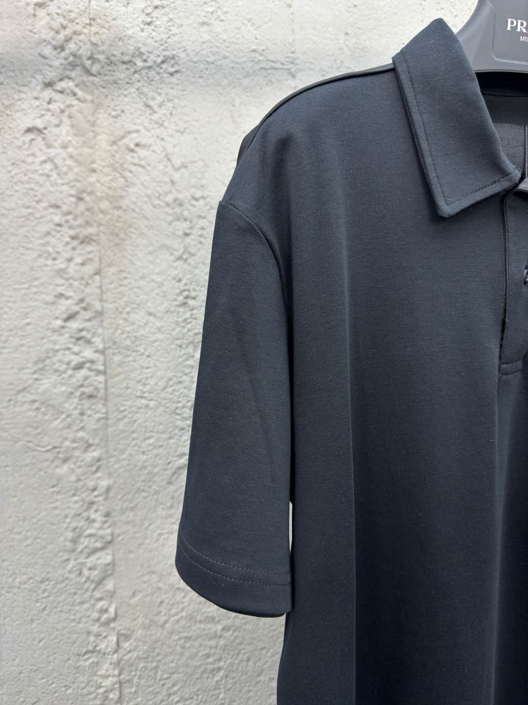 Polo à poche zippée