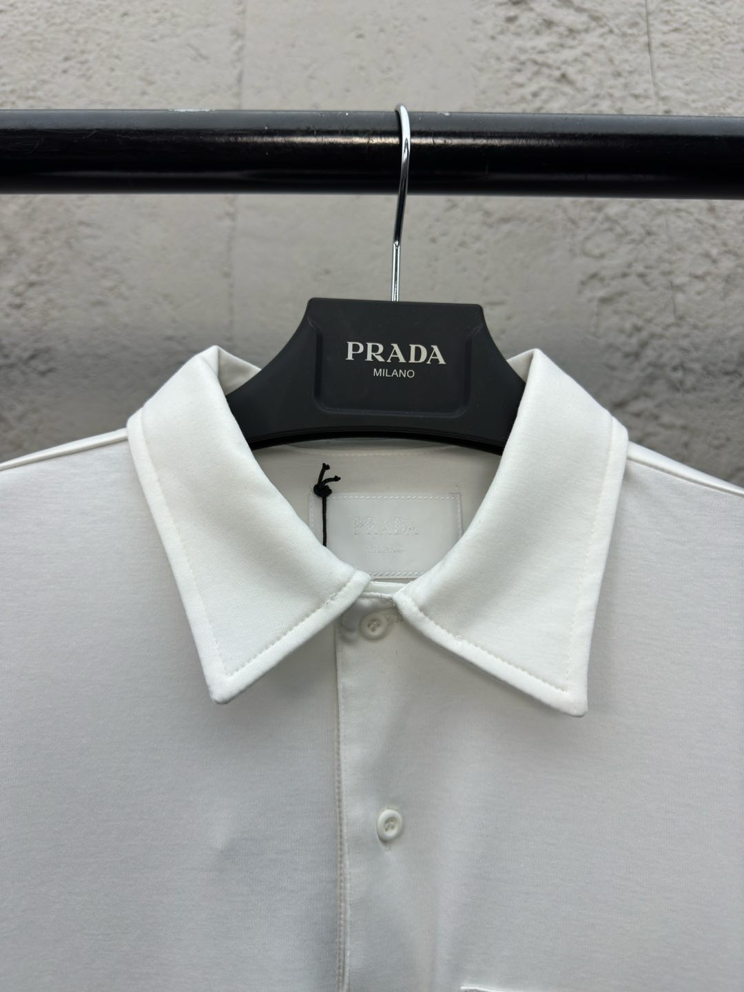 Polo à poche zippée