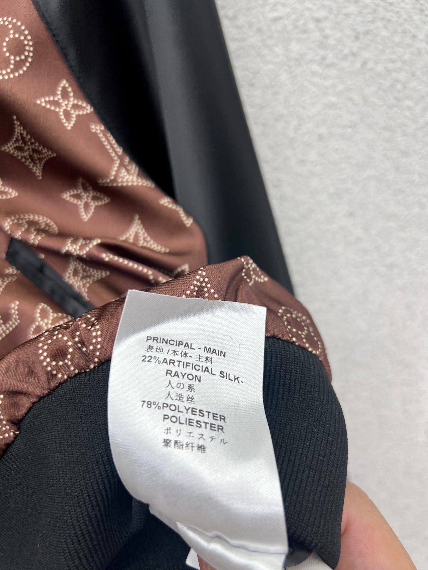 Veste réversible en laine jacquard à capuche et fermeture éclair