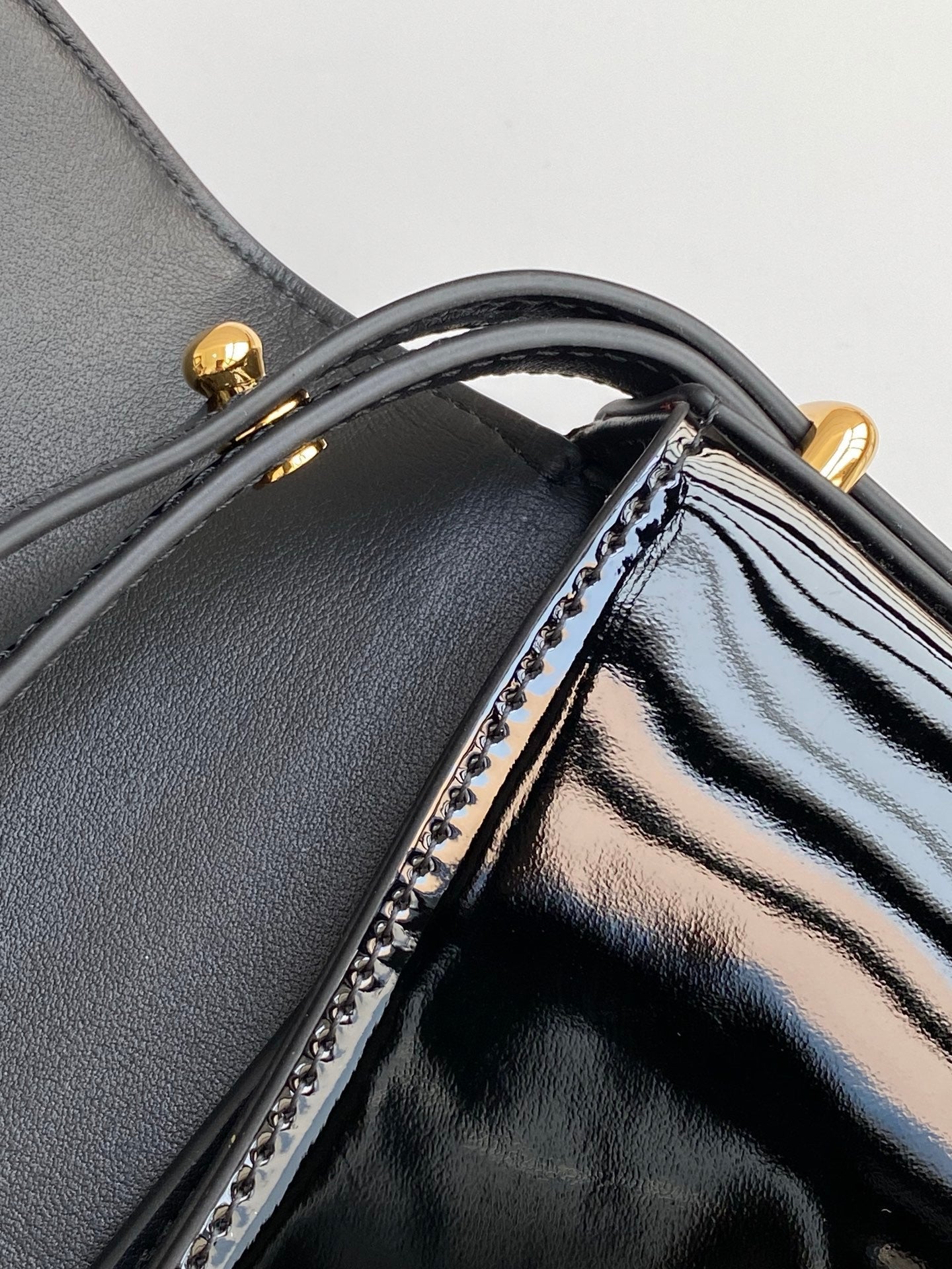 Black Patent Leather Baguette Bag with Gold Accents