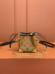 Noé Purse V Charms Monogram Reverse