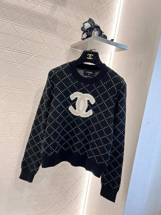 Pull brodé à motif losanges