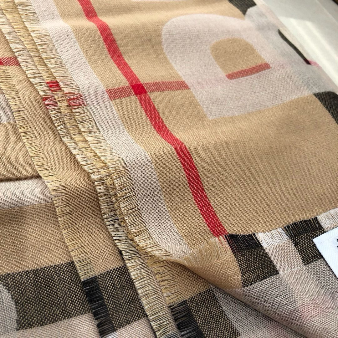 Écharpe à pompons double face