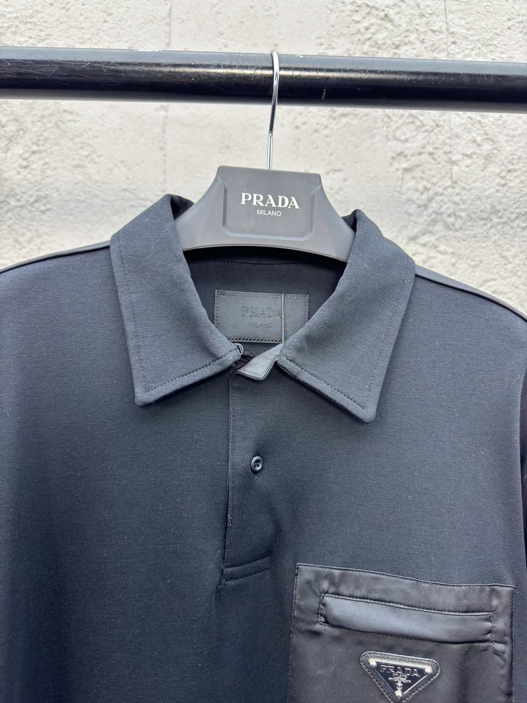 Polo à poche zippée