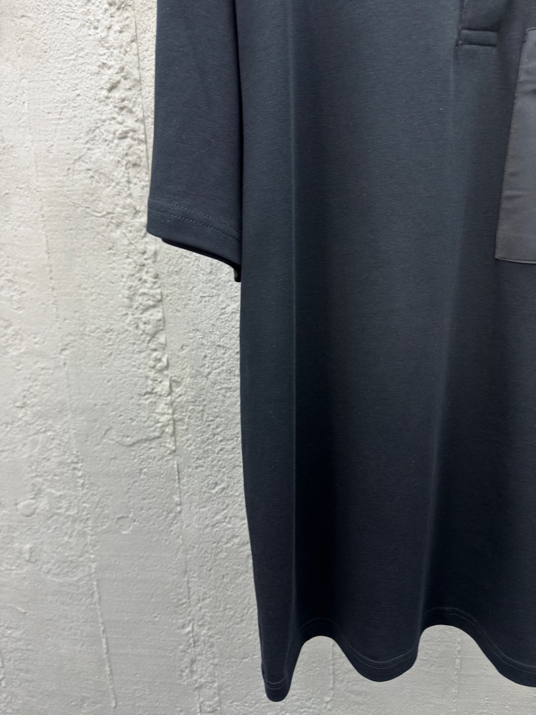 Polo à poche zippée