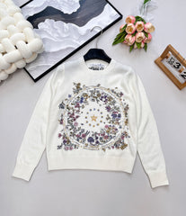 Wool sweater with gold floral and star embroidery