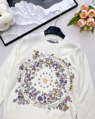Wool sweater with gold floral and star embroidery