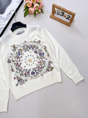 Wool sweater with gold floral and star embroidery