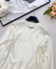 Wool sweater with gold floral and star embroidery