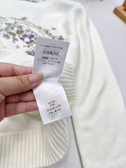 Wool sweater with gold floral and star embroidery