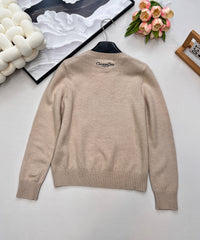 Wool sweater with gold floral and star embroidery