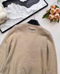 Wool sweater with gold floral and star embroidery