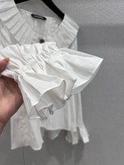 Single-breasted pleated long-sleeved shirt with a baby doll collar