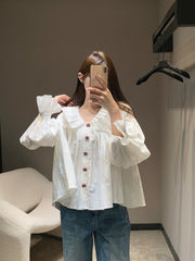 Single-breasted pleated long-sleeved shirt with a baby doll collar