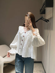 Single-breasted pleated long-sleeved shirt with a baby doll collar