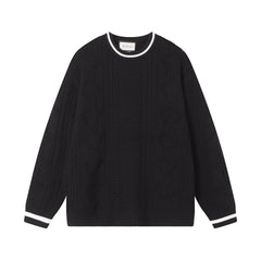 Pull à découpes torsadées