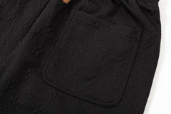 Dunkle, geblümte Strickshorts