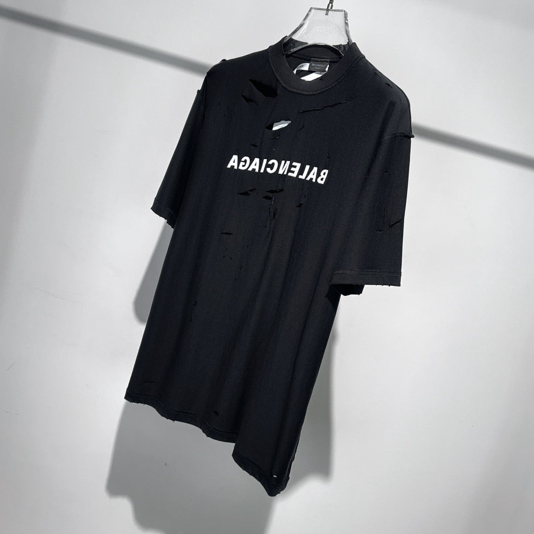 Le nouveau couteau à la mode de l'été coupe des trous dans le t-shirt court à col rond en coton, 