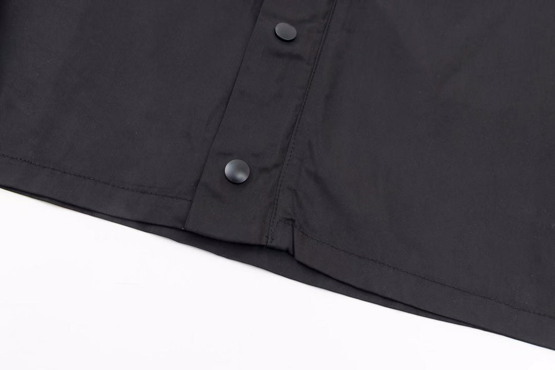 veste légère à logo triangulaire