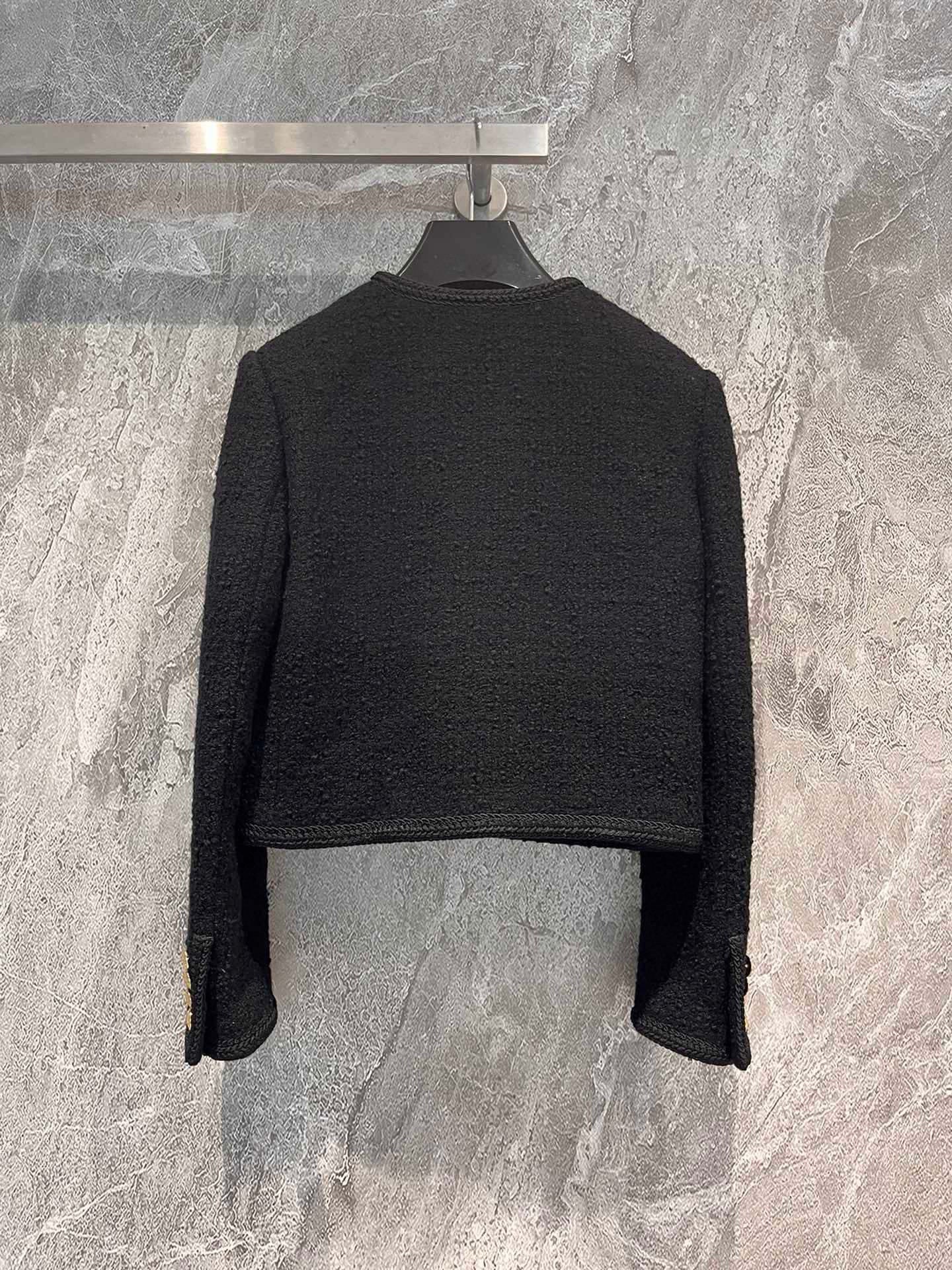 Veste en tweed noir et or