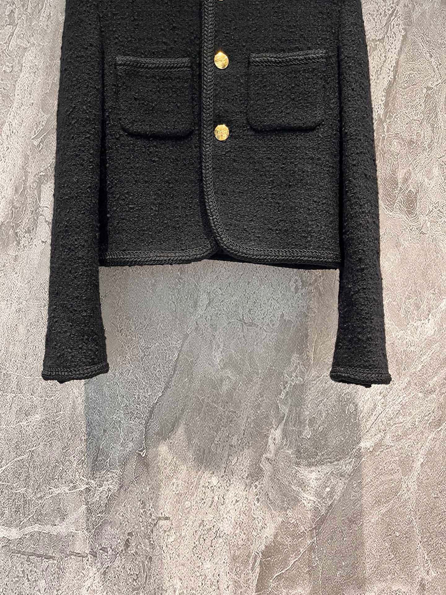Veste en tweed noir et or