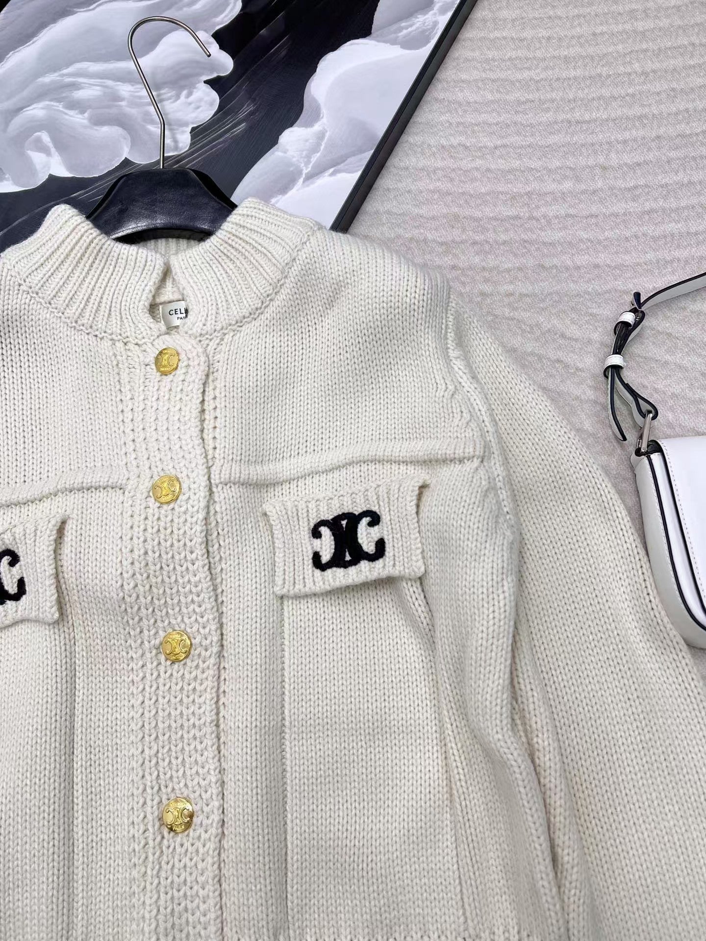 Neue Strickpulloverjacke