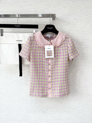 Short-sleeved tweed top with a baby doll collar