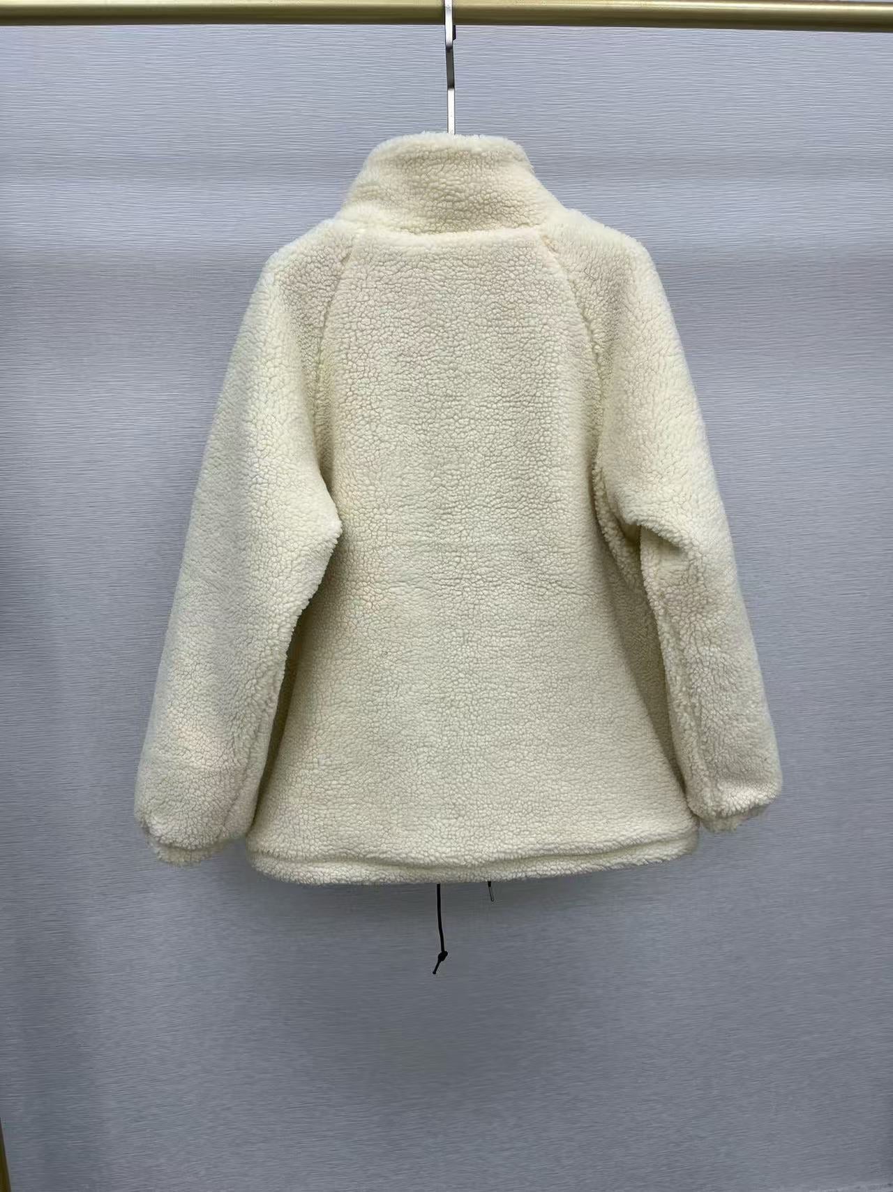 Veste matelassée en laine d'agneau noire avec poche