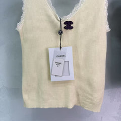 Knitted vest with lace collar and cuffs