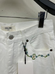 White denim shorts with embroidered letters