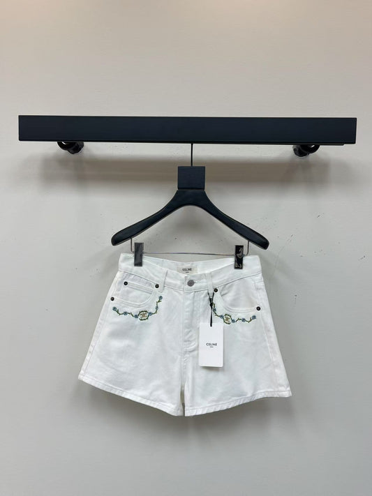 White denim shorts with embroidered letters
