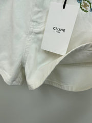 White denim shorts with embroidered letters