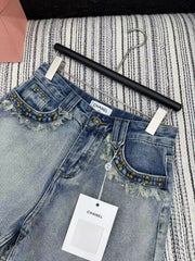 Heavy rivet tassel embroidered denim shorts