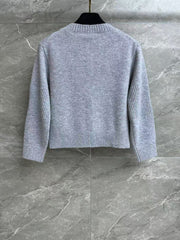 Cashmere cardigan with school bag button
