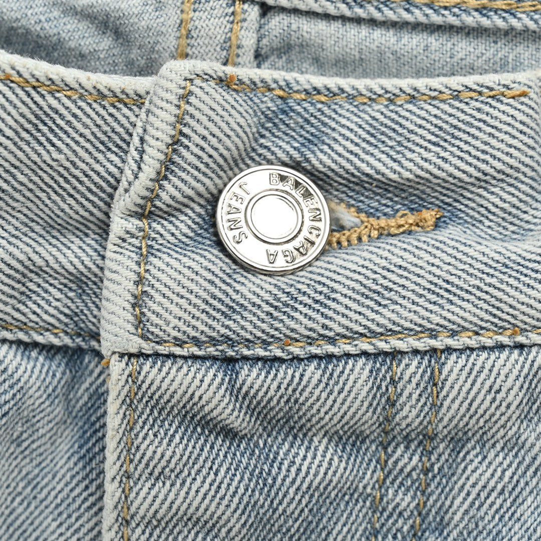 short en jean à ourlet à pompons vieilli