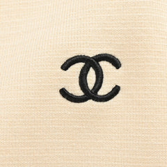 Veste pull en tricot contrasté avec revers et logo CC