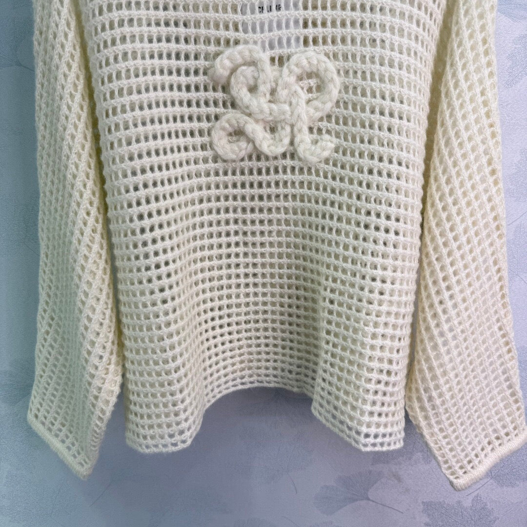 New early autumn hooded hollow knit sweater