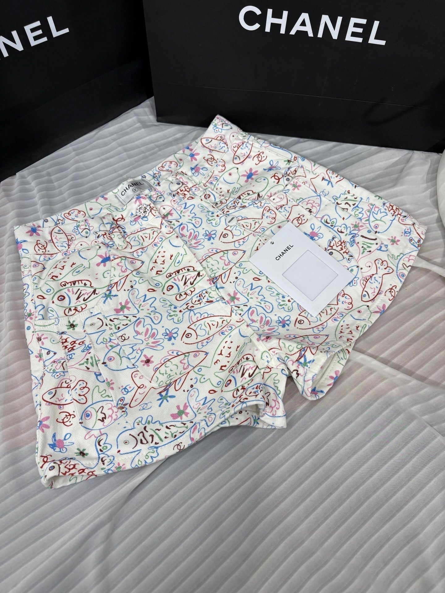 Fish print denim shorts