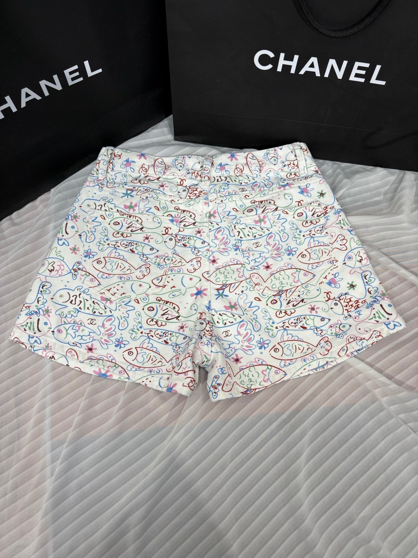 Fish print denim shorts