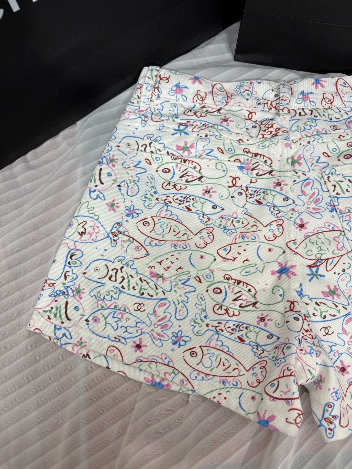 Fish print denim shorts