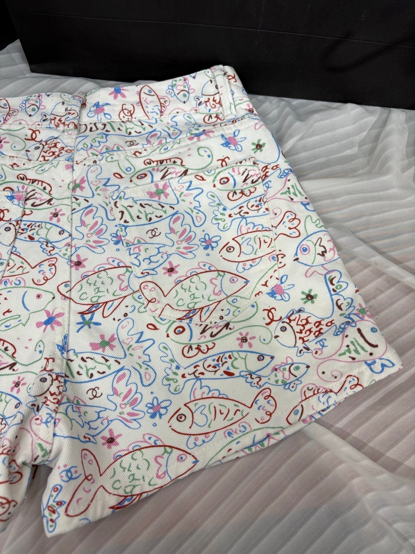 Fish print denim shorts