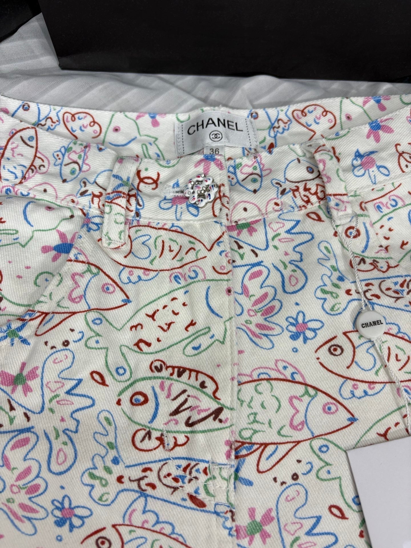 Fish print denim shorts