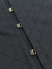 T-shirt ras du cou noir avec matelassage en strass et accessoires au dos 