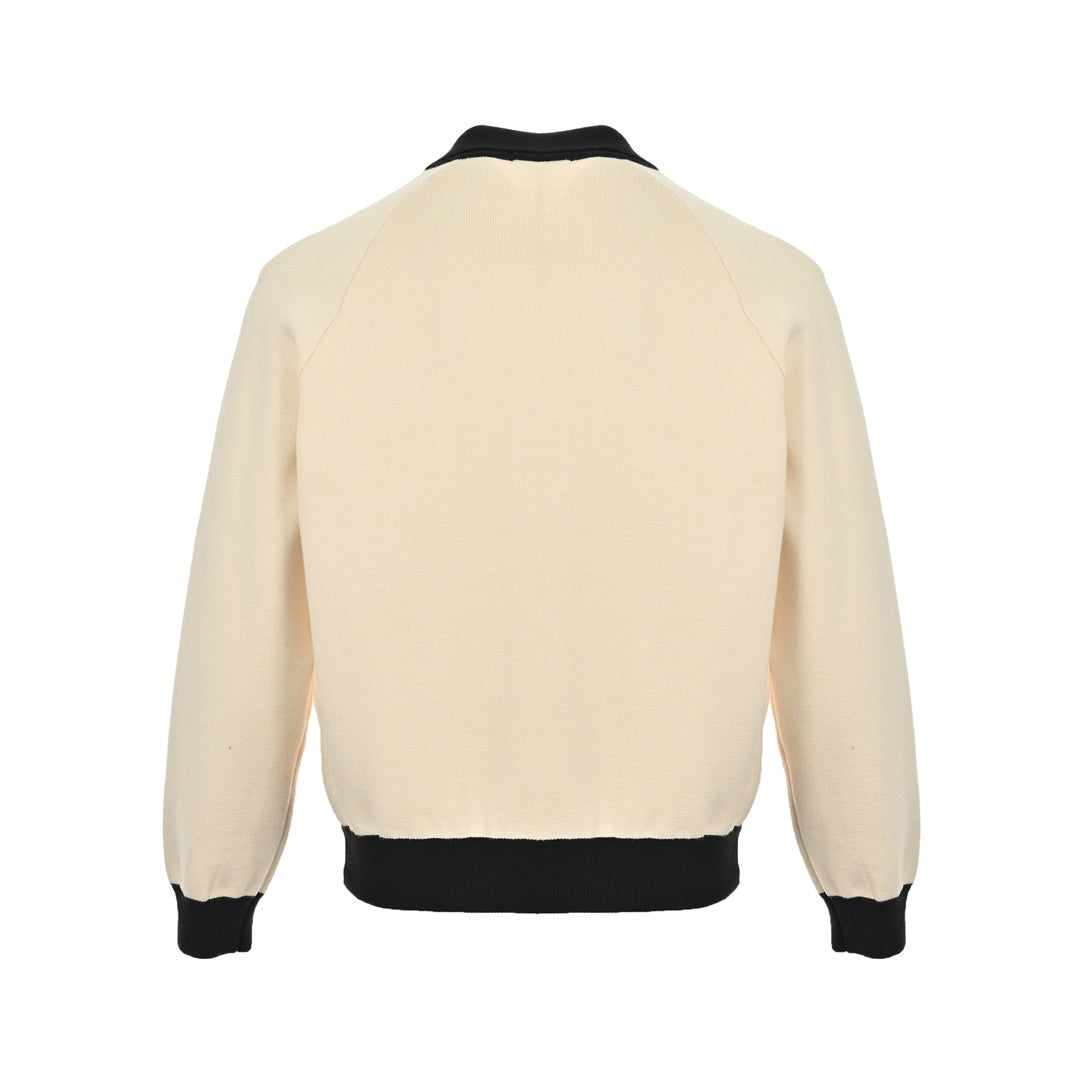 Veste pull en tricot contrasté avec revers et logo CC