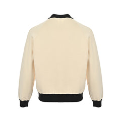 Veste pull en tricot contrasté avec revers et logo CC