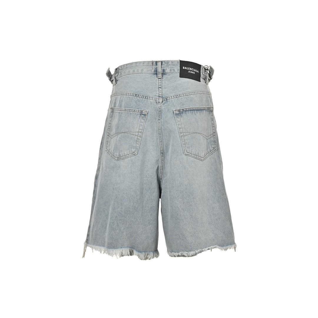 short en jean à ourlet à pompons vieilli